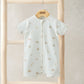 Shortie romper in light cream with all-over safari animal print, front zip, short sleeves.