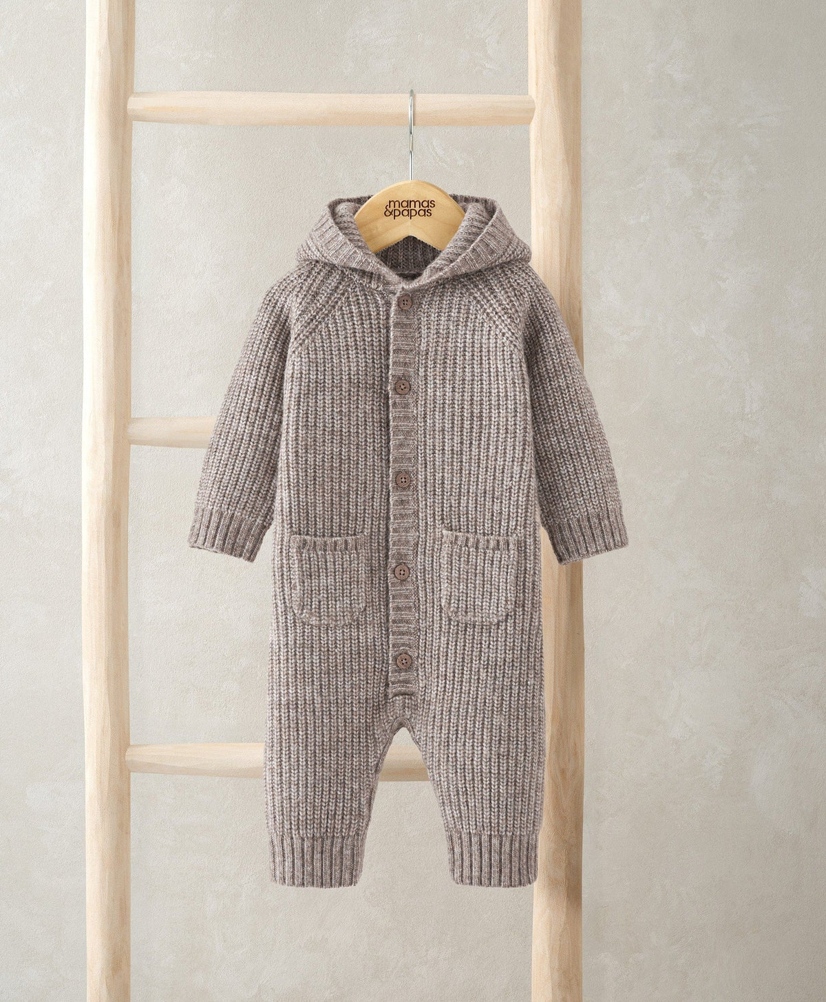 Grey ribbed knit hooded romper with long sleeves, button front, and front pockets
