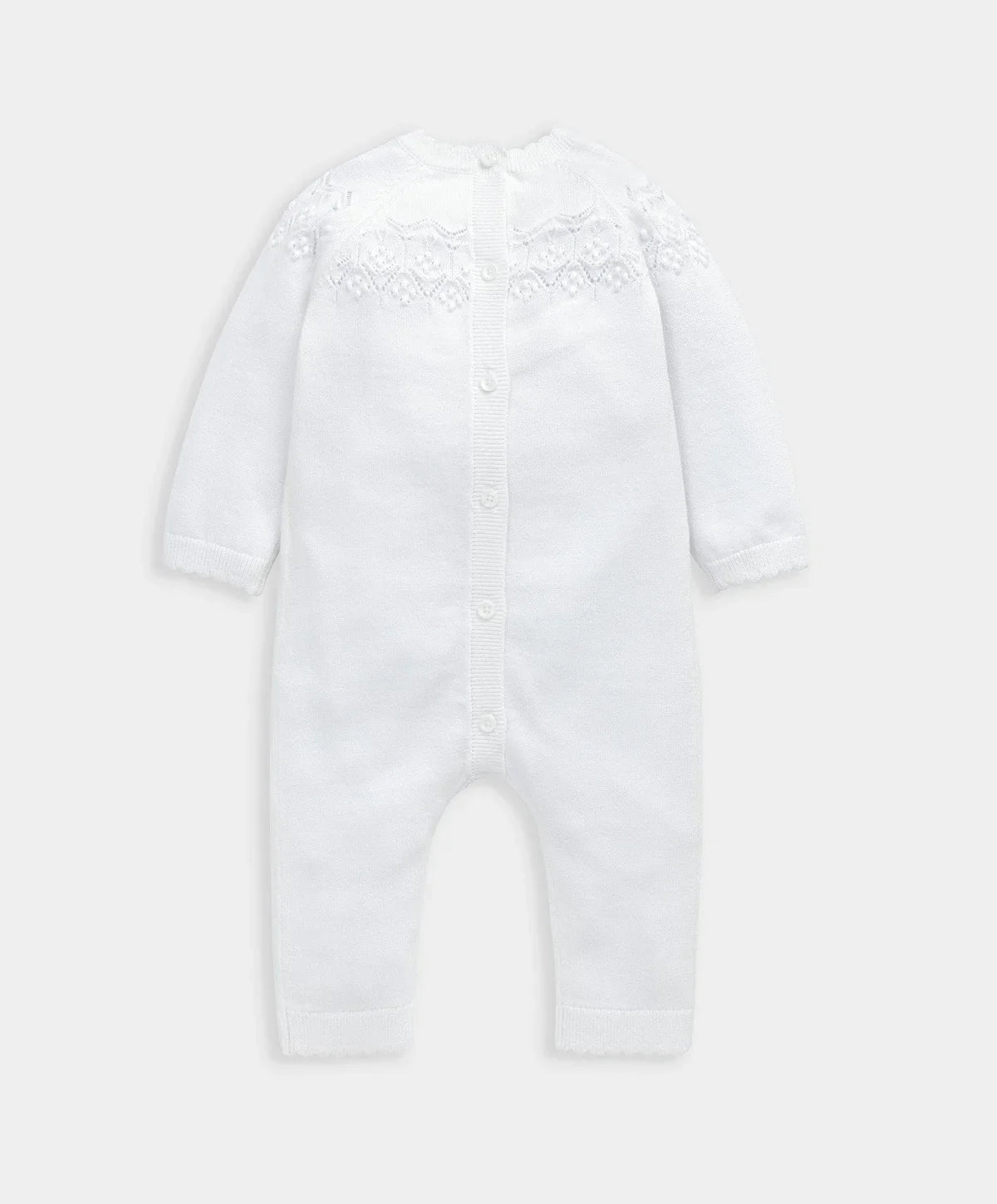 White pointelle knitted romper with button front and long sleeves