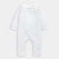 White knitted romper with textured pointelle yoke and long sleeves