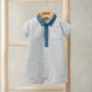 Striped polo romper with teal collar and button placket, short sleeves, hanging