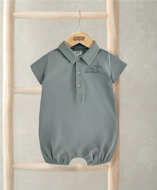 Jersey romper with polo collar, short sleeves, button placket, and small chest graphic