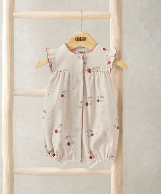 Cream cherry print shortie romper with ruffled sleeves and button front