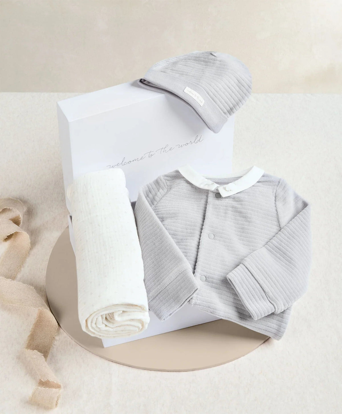 3-piece baby boy gift set: ribbed hat, long-sleeve onesie, footed romper