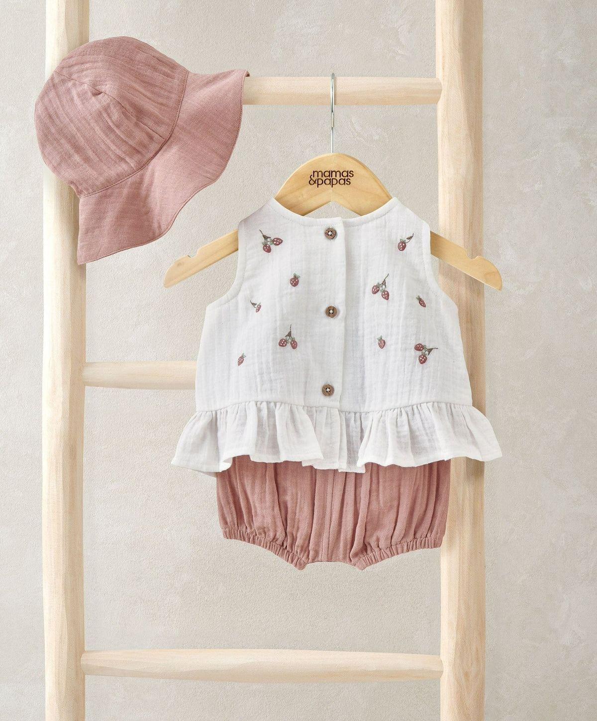 Peach bucket hat, white swing top with cherry print and gold buttons, pink bloomers