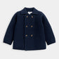 Navy knit cardigan with button front and dark collar, long sleeves
