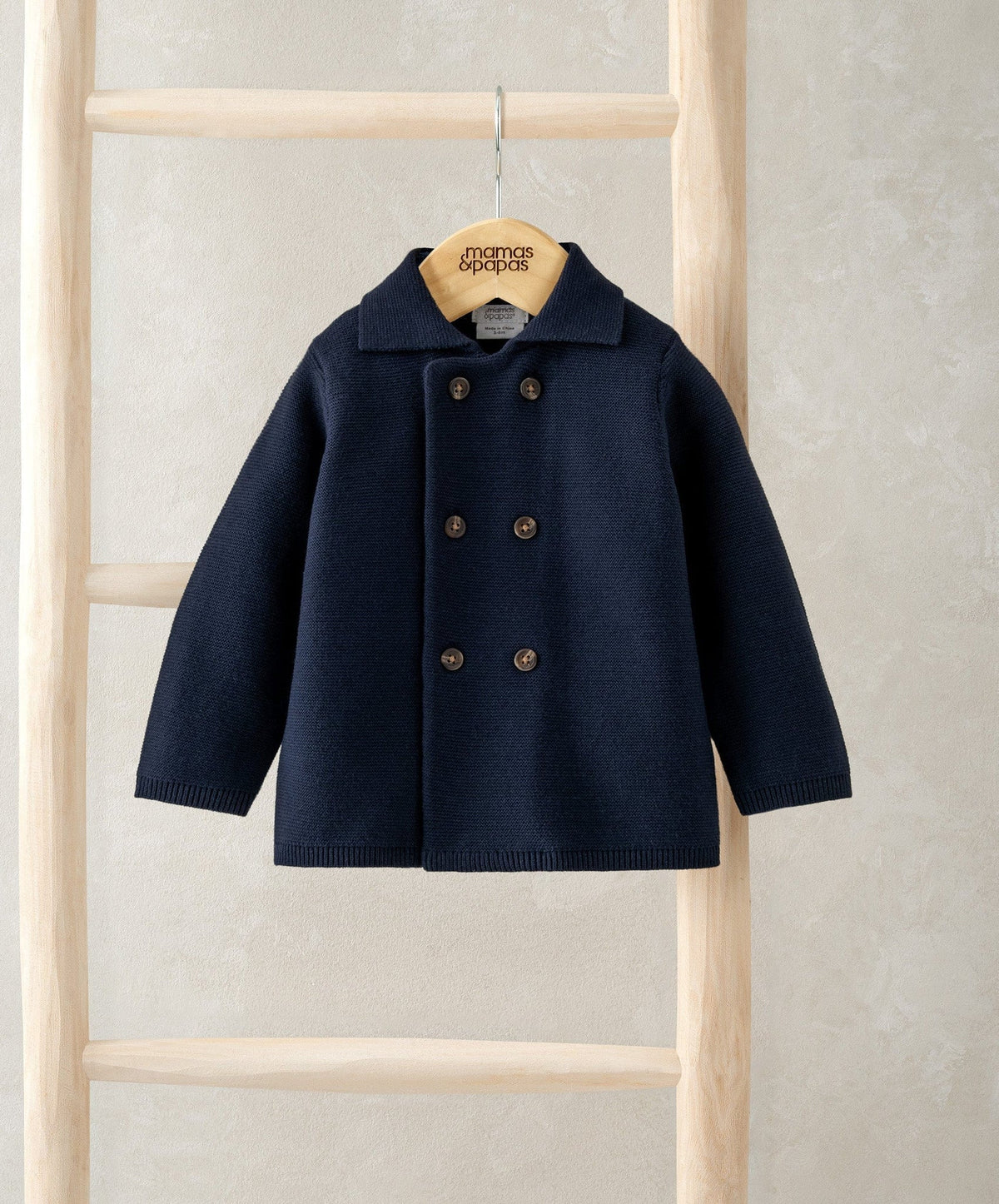 Navy double-breasted cardigan with pointed collar and long sleeves
