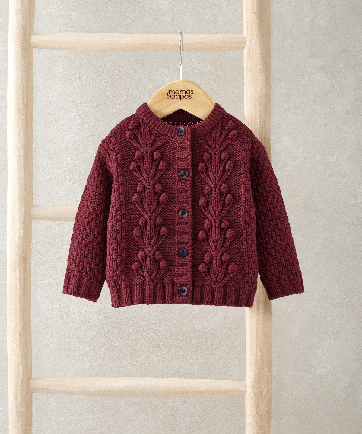 Burgundy bobble knit cardigan with round neck and button front, long sleeves