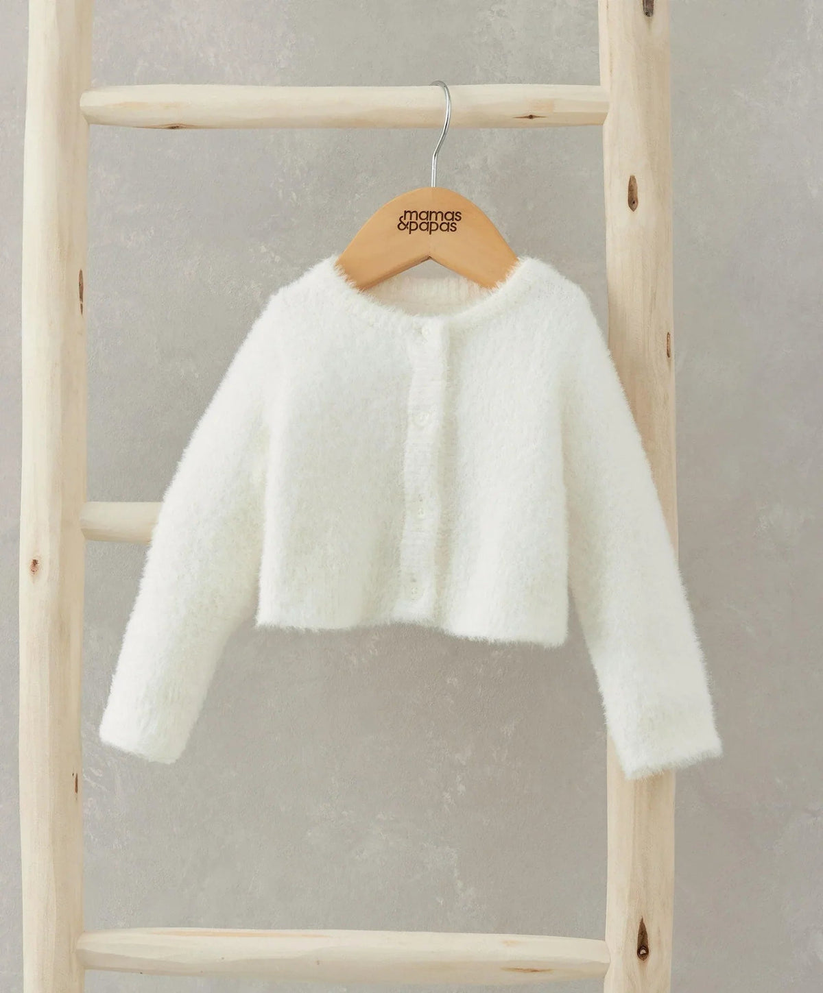 White fluffy cropped cardigan with long sleeves and crew neck