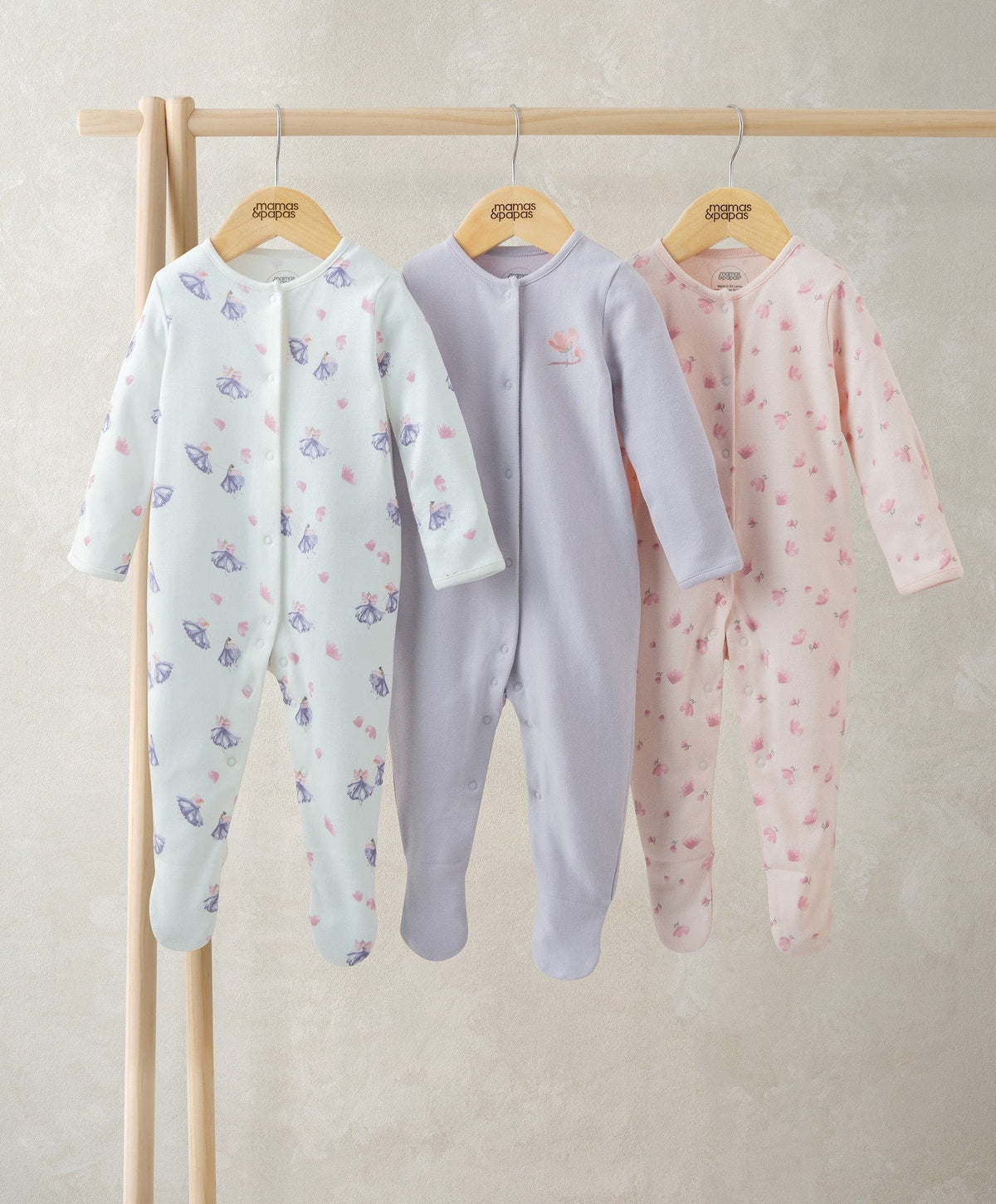 Pack of three ballerina sleepsuits, footed long-sleeve with all-over printed ballet figures