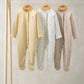 3 floral sleepsuits: yellow solid, white patterned, taupe small dots