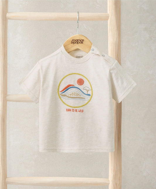 Embroidered light baby T-shirt on hanger, rainbow landscape graphic at center