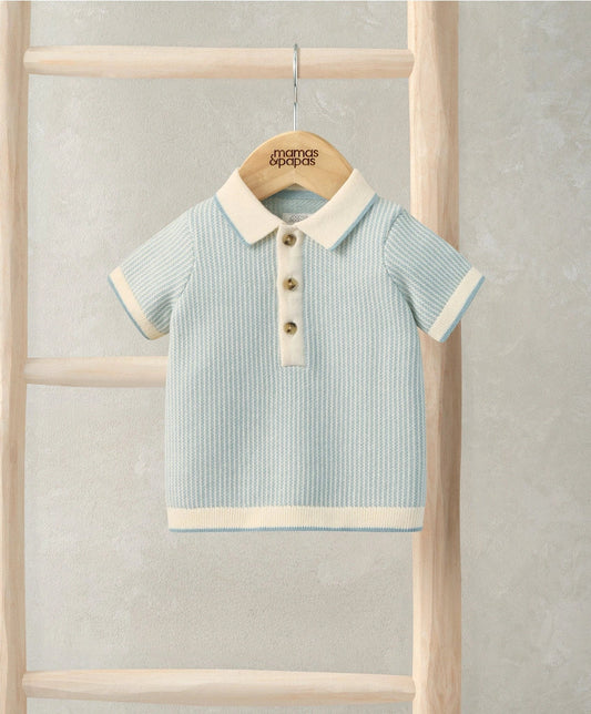 Light blue jacquard knitted polo shirt with cream collar and button placket