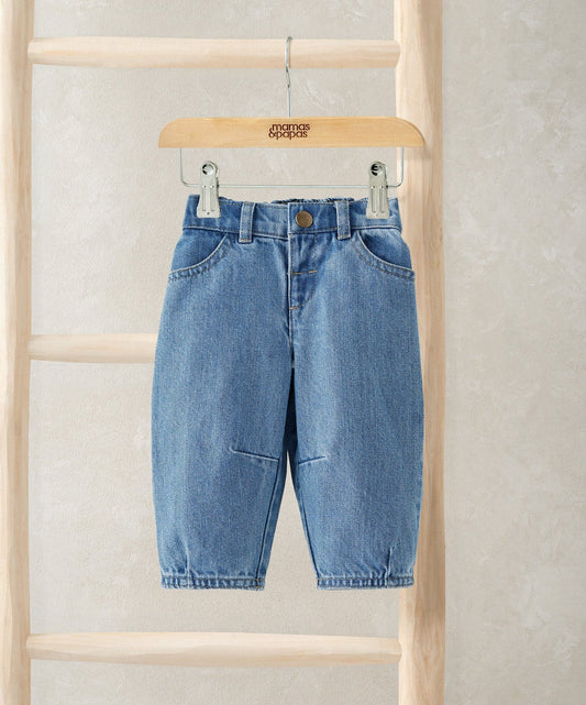 Light blue barrel-leg jeans with button fly and belt loops