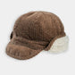Brown trapper hat with fleece-lined earflaps and stitched ribbed crown