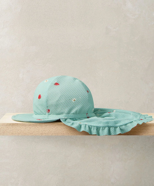 Turquoise peaked sunhat with strawberry pattern and ruffled brim