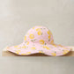 Lemon print floppy sunhat, light pink with yellow fruit pattern and wide brim