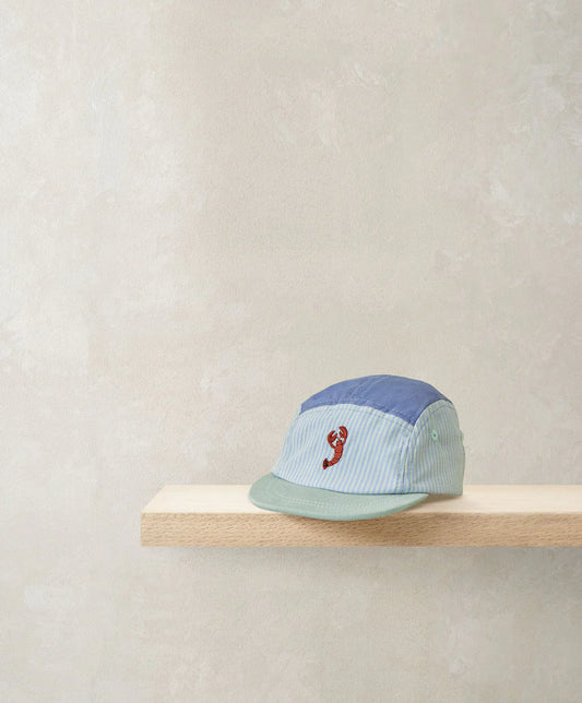Light blue striped cap with green brim and red crab logo, side button