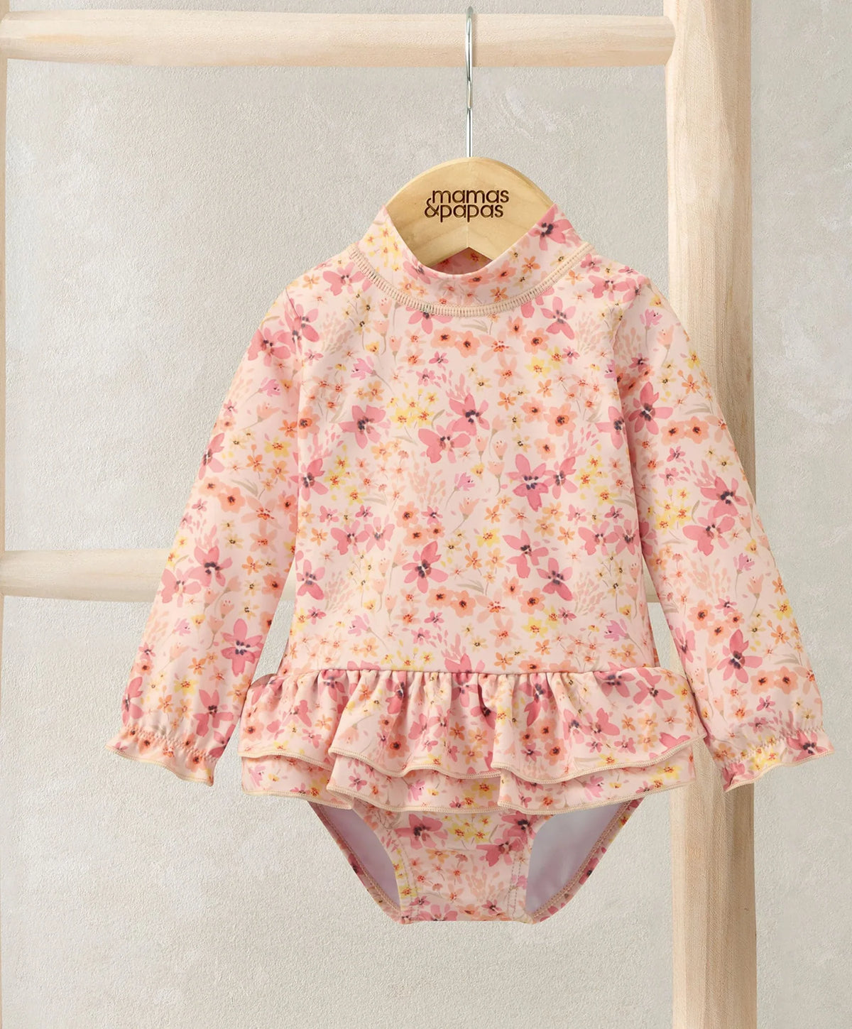 Pink floral long-sleeve one-piece swimsuit with ruffle waist and high neck
