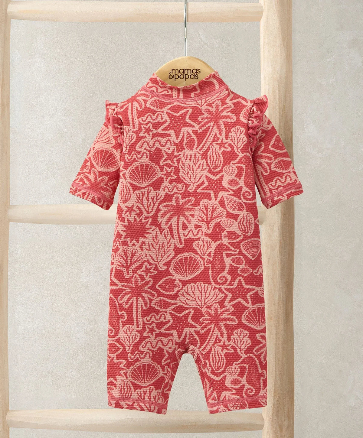 Kids seahorse rashsuit in red with white ocean print, long sleeves and high neck