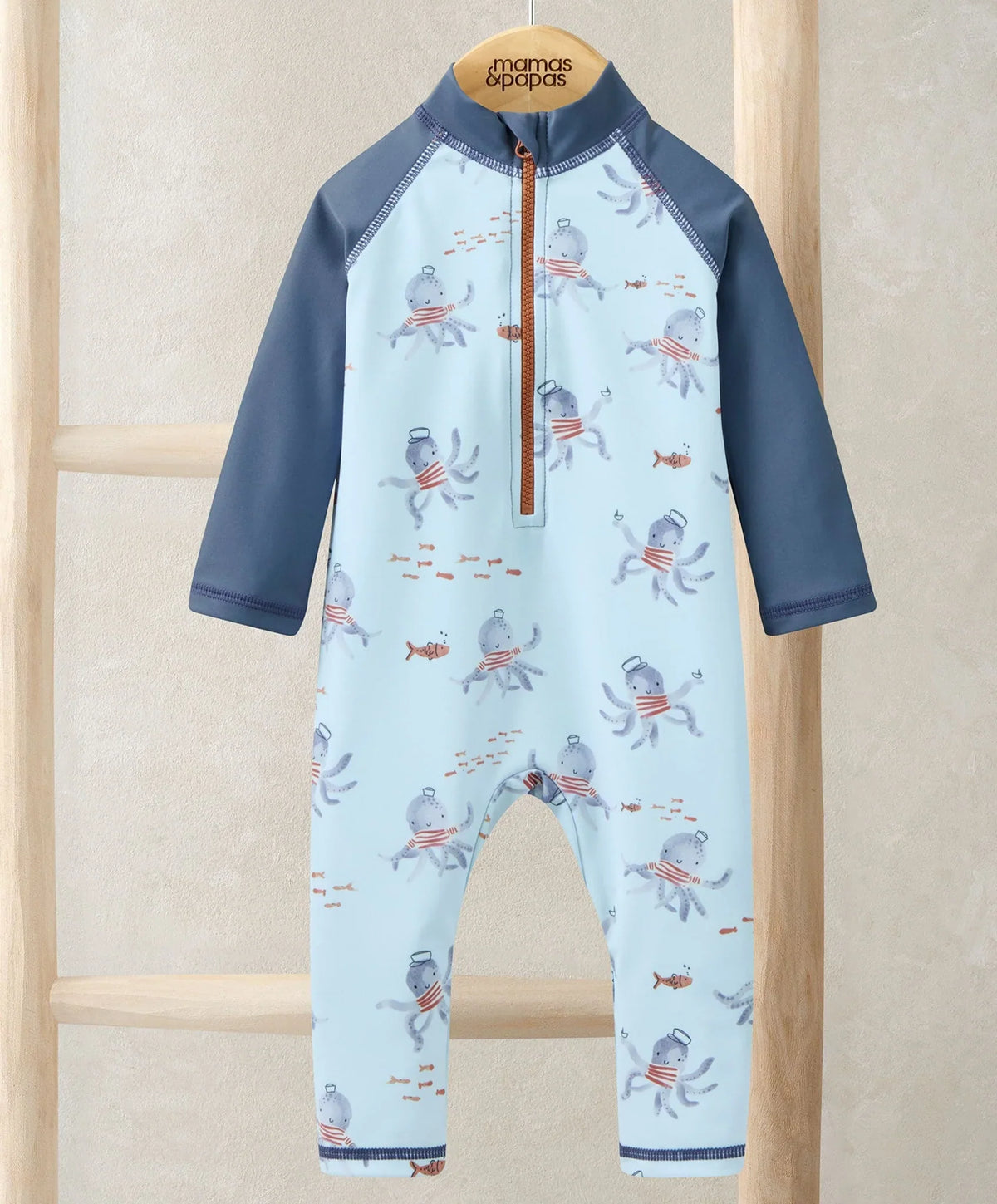 Squid print rashsuit with front zip, light blue body and navy raglan sleeves