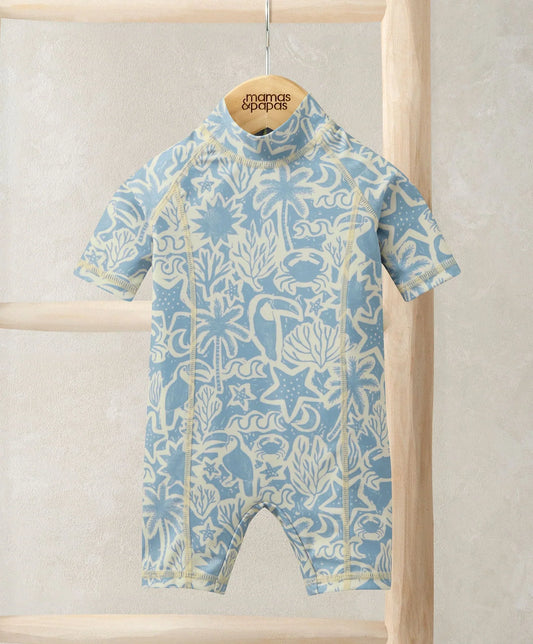 Toucan print rashsuit in light blue with long legs and short sleeves