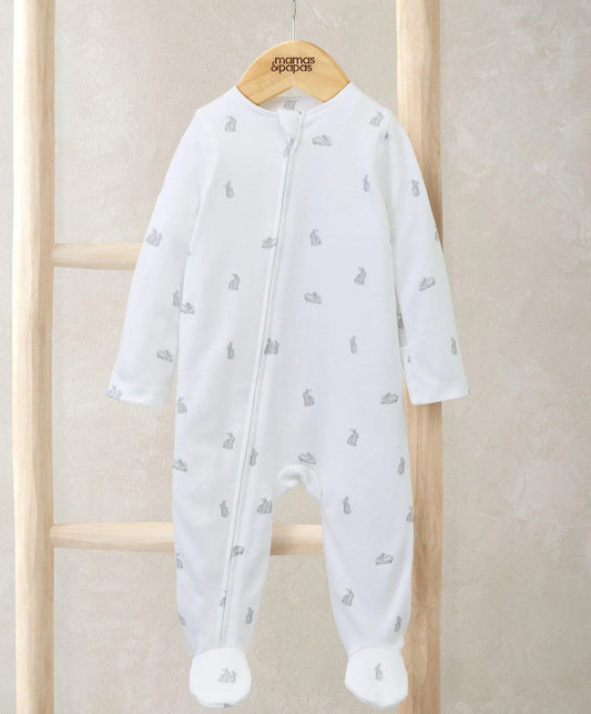 Bunny-print zip all-in-one romper, white with small bunny icons, long sleeves, footed