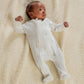 Baby zip-front all-in-one romper with celestial print, long sleeves, white