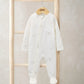 Baby zip-front all-in-one romper with celestial print, front zipper, long sleeves, white