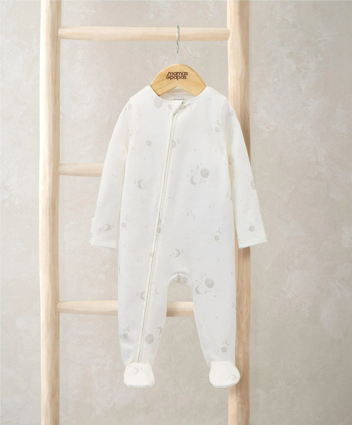 Baby zip-front all-in-one romper with celestial print, front zipper, long sleeves, white