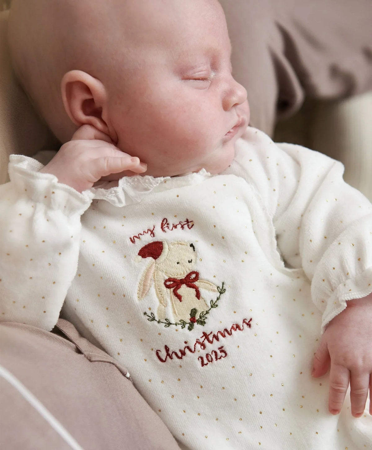 Cream baby bunny Christmas onesie with embroidered bunny and text on chest