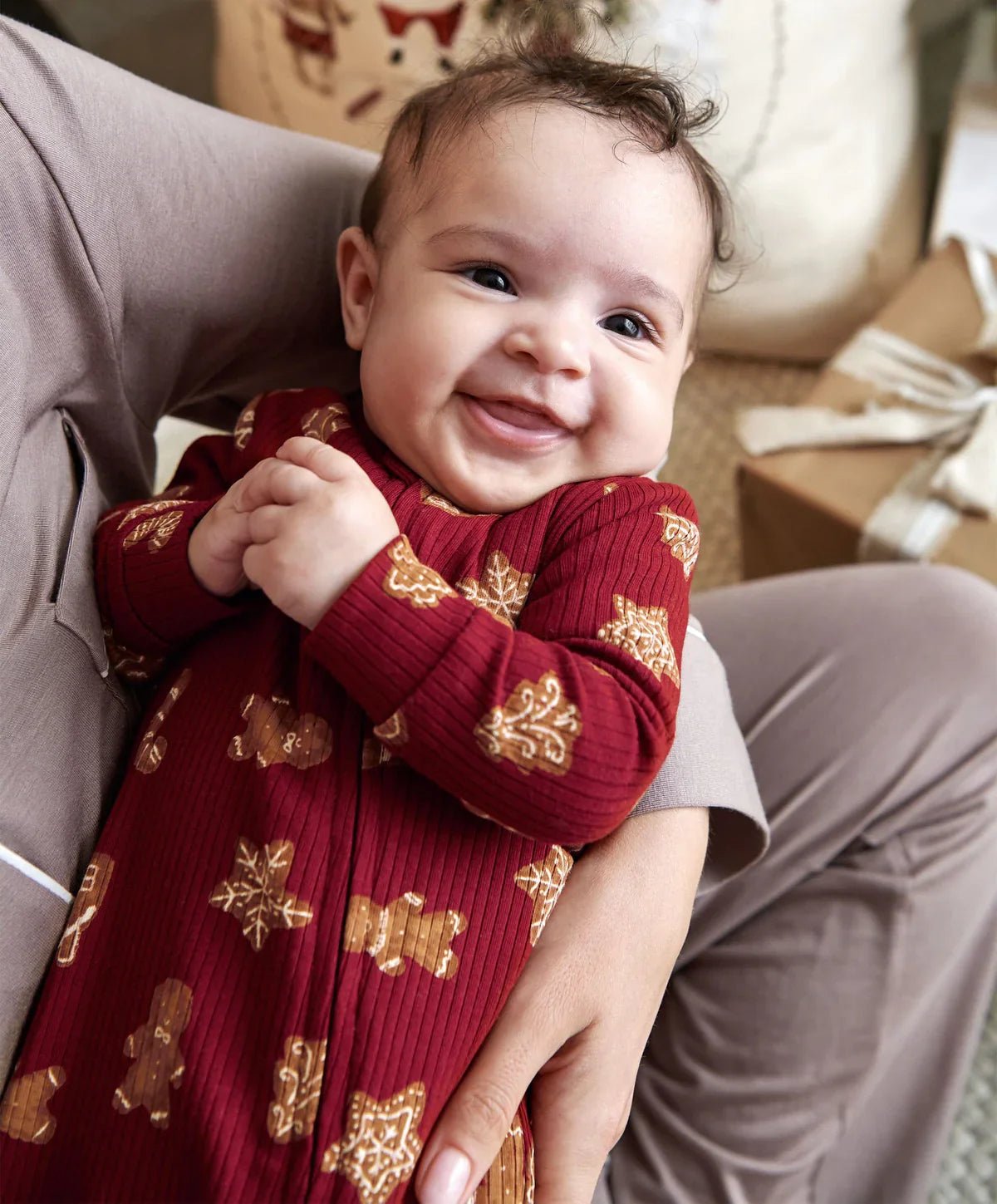 Baby all-in-one romper in dark red with gingerbread cookie print, long sleeves