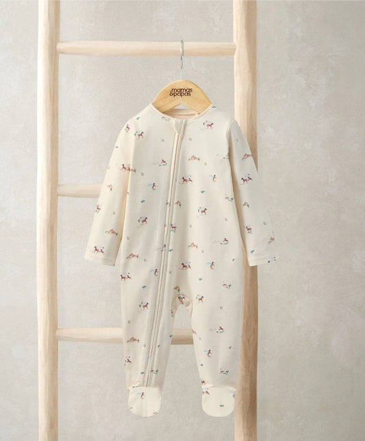 Off-white footed zip sleepsuit with long sleeves and scattered animal print, full front view