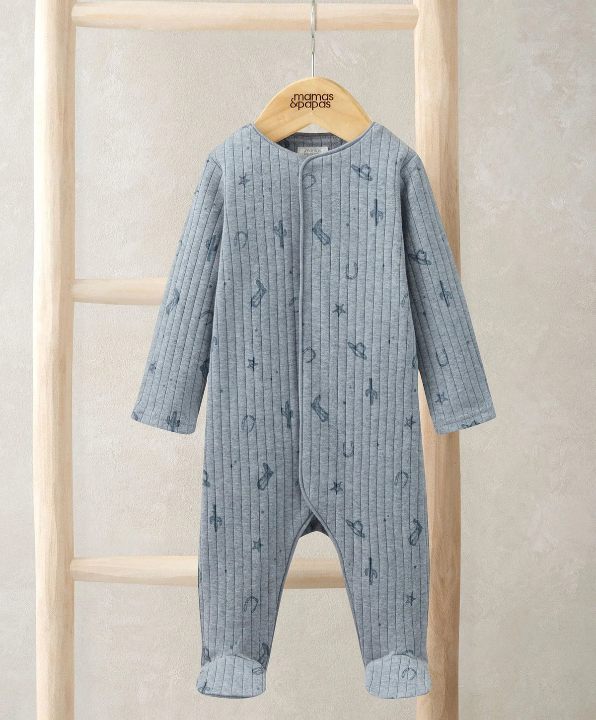 Blue knit sleepsuit with full-length zipper, long sleeves, and footed legs.