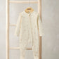 Cream floral zip sleepsuit with long sleeves, footed legs, and front zipper