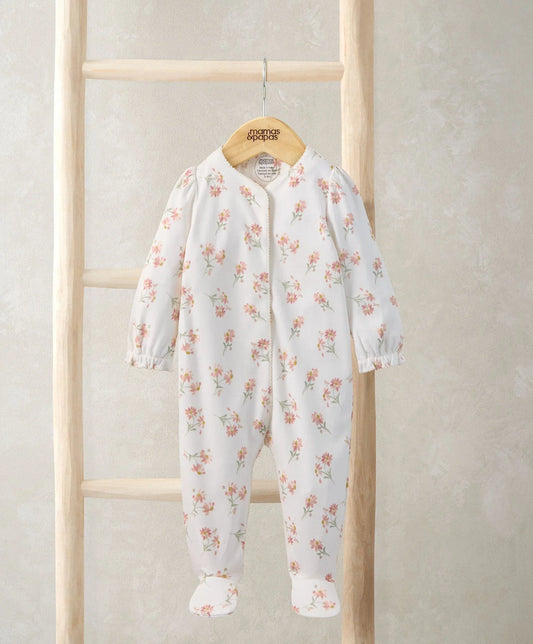 Daisy-print sleepsuit with long sleeves and footed legs, white with pastel flowers