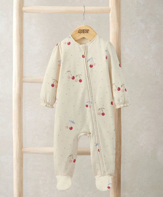 Cherry all-in-one baby romper, cream with cherry print, full-zip front and long sleeves