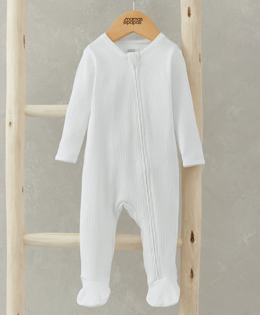 White ribbed organic cotton sleepsuit with footed legs and long sleeves