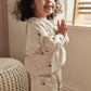 Cherry sweatshirt worn by child, cream with cherry print, long sleeves