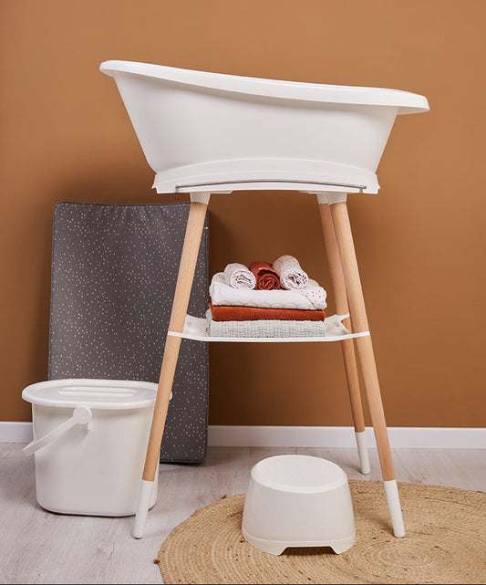 White bath stand with open tub and matching accessories, plus gray dotted mat