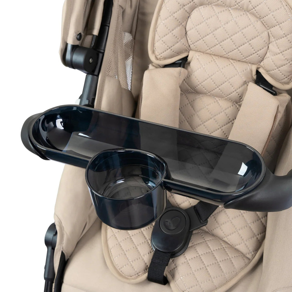 Stroller tray with cup holder and armrest, beige quilted seat close-up