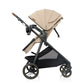 Beige baby stroller with canopy and black frame, front three-quarter view