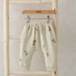 Cream acorn print joggers with elastic waistband and drawstring