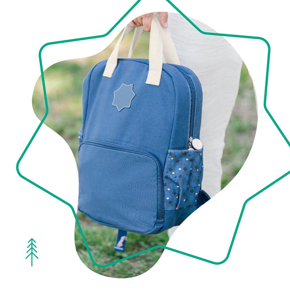 Navy changing backpack with star patch, front pocket and side attachment