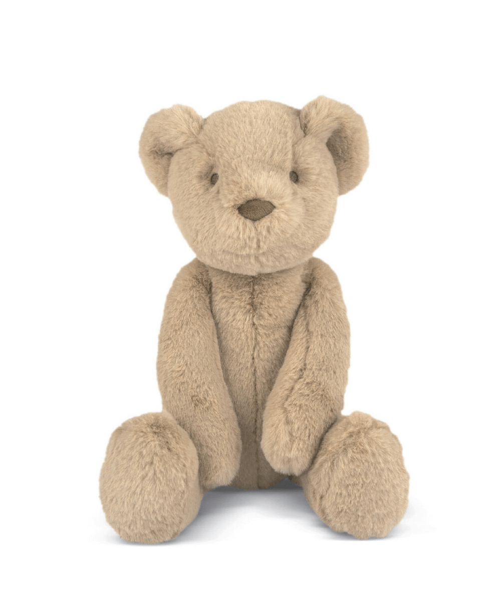 Beige teddy bear soft toy sitting upright with stitched nose and smiling mouth