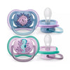 Double pacifier set with sea horse and turtle prints, purple and blue ring frames