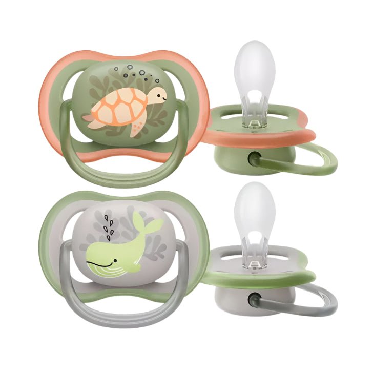 Double pacifier set with turtle and sea animal prints, green and orange ring frames