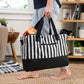 Black-and-white striped canvas tote bag with pocket and handles