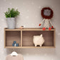 Pale oak open shelf unit with three compartments, styled with decor and hanging items