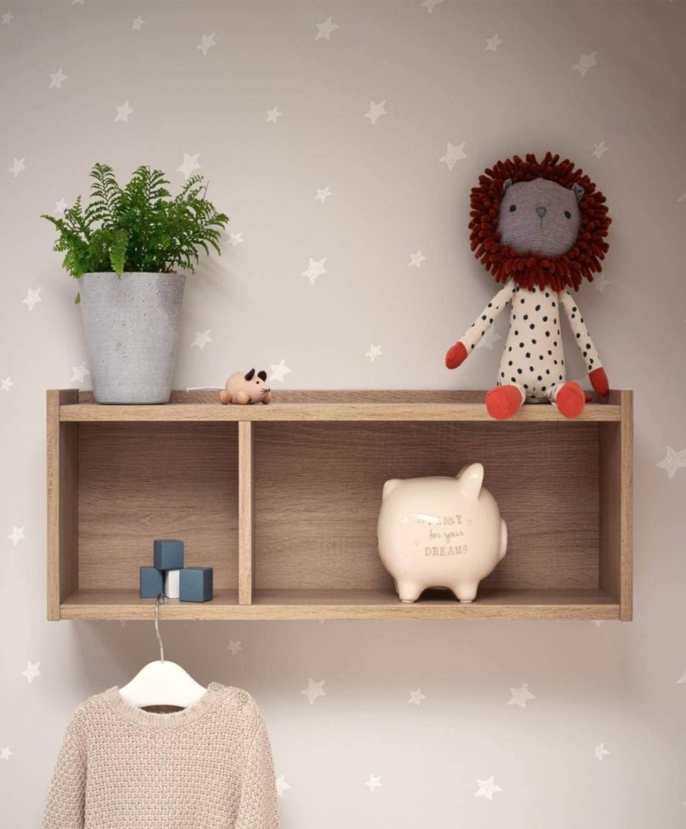 Pale oak open shelf unit with three compartments, styled with decor and hanging items